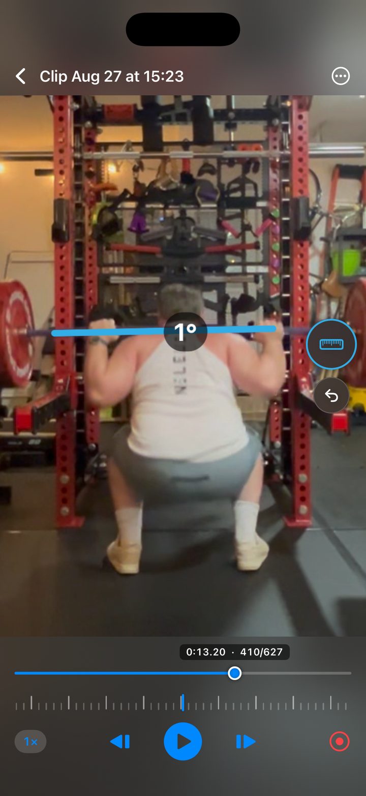 A squat paused on one frame in Pretty Good Video Coaching.